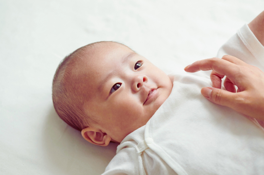 Infant laying on their back during CPR training