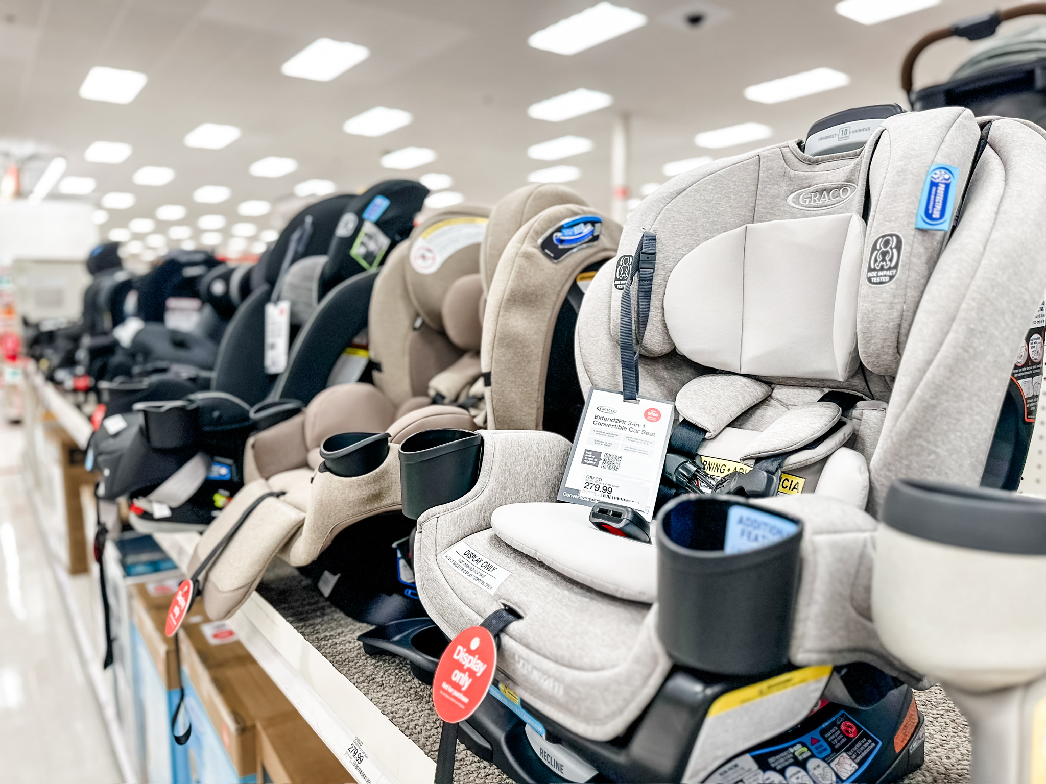 Car seats displayed on a retail shelf